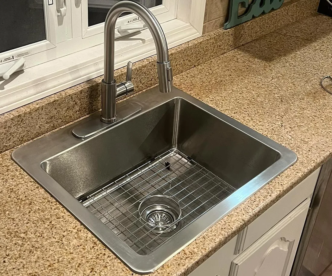Stainless steel sink set in a granite countertop